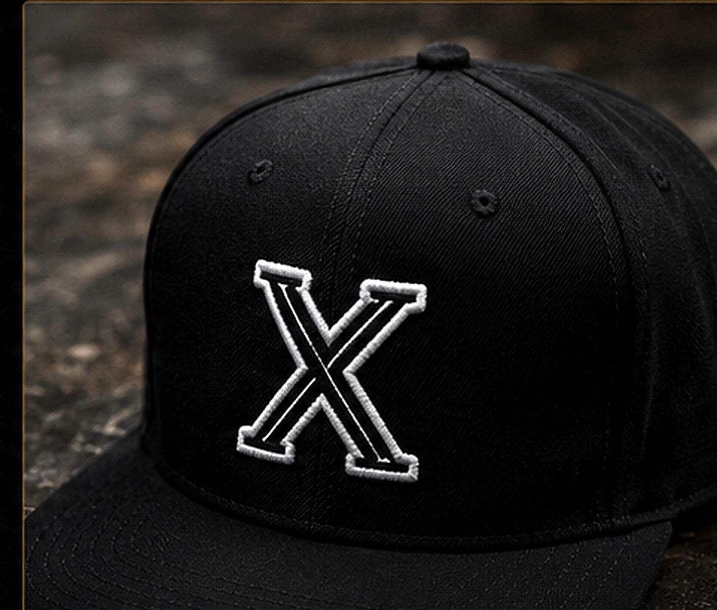 XtraCustom premium black custom headwear with embroidered X mark
